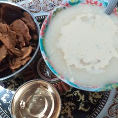 A picture of Semolina pap with groundnut cake.