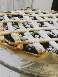 Una foto de Kuchen de arándanos flameados