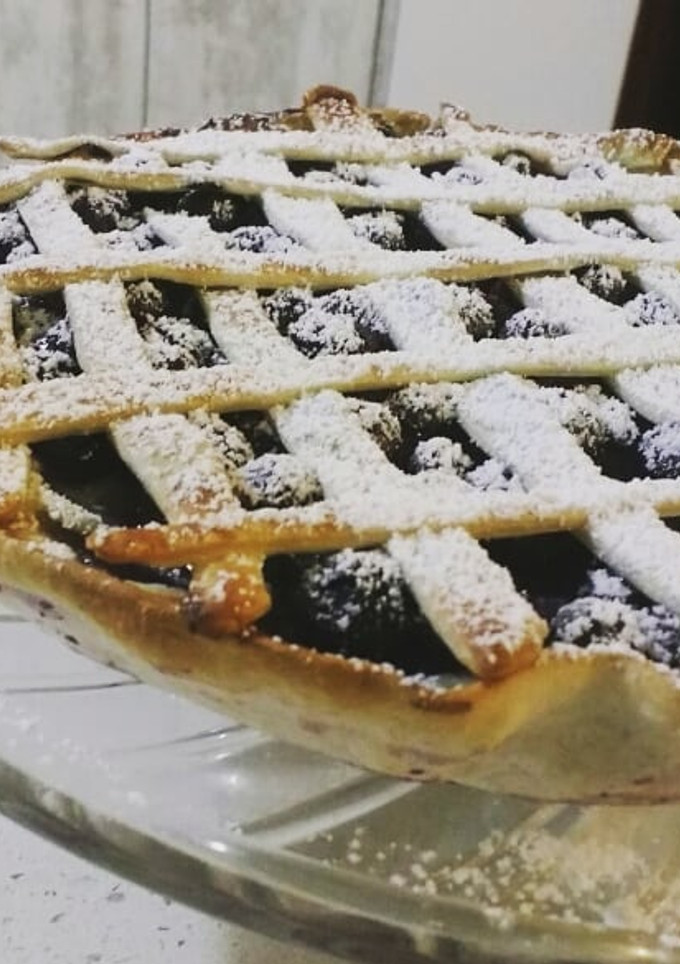 Una foto de Kuchen de arándanos flameados