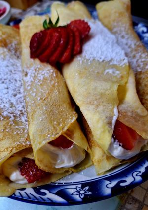A picture of Crepes with Strawberries and Whipped Cream 🍓.