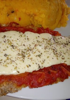 Una foto de Milanesas de Carne a La Napolitana