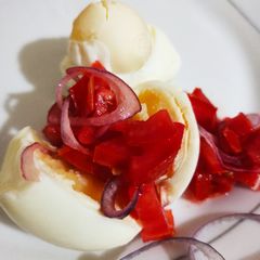A picture of Boiled eggs with kachumbari.
