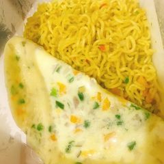 A picture of Fried omlette and noodles.
