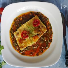 A picture of Frittatas in Chimichurri sauce.