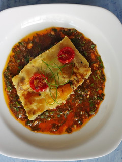 A picture of Frittatas in Chimichurri sauce.