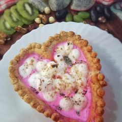 A picture of Dragon fruit custard with Meringue Hazelnut Tart.