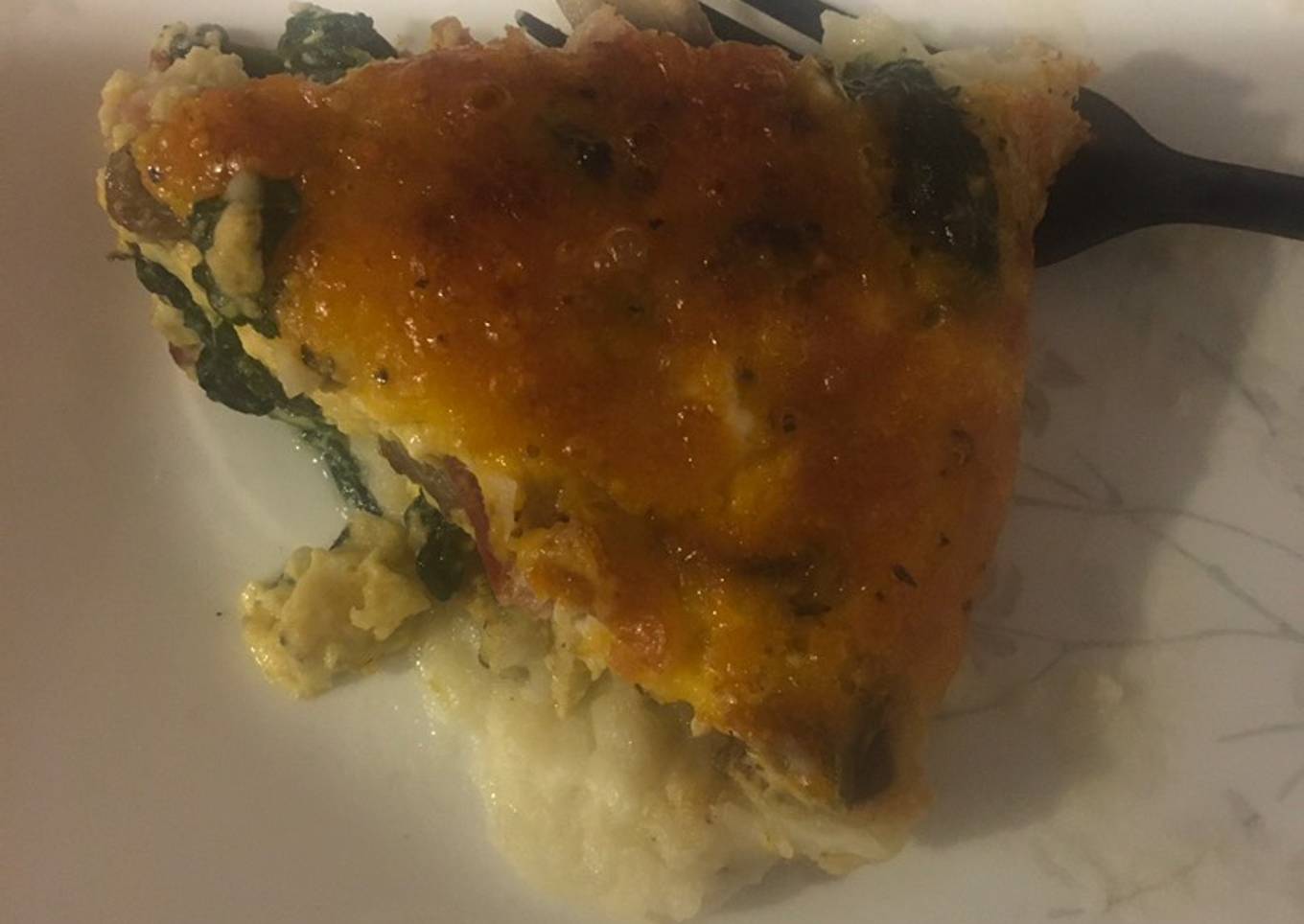 Spinach quiche with potato crust