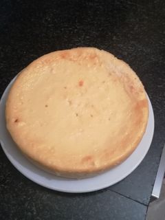 Una foto de Tarta de queso con esencia de ron y coco rallado en la olla gm
