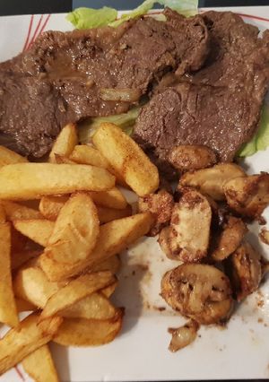 A picture of My Garlic Butter Sirloin Steak with mushrooms & thick cut Chips.
