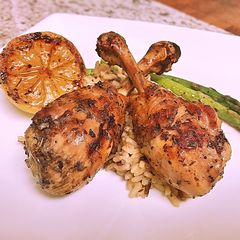 French cut grilled lemon pepper drums with wild rice and asparagus A picture of French cut grilled lemon pepper drums with wild rice and asparagus.