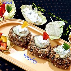 A picture of Falafel-Salsa-Baba ghanoush-Tzatziki-Salad.