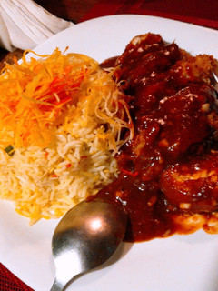 A picture of Egg fried rice with red dragon.