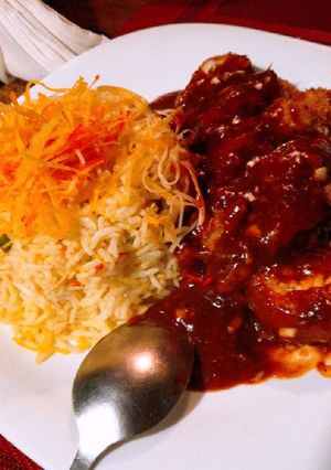 A picture of Egg fried rice with red dragon.