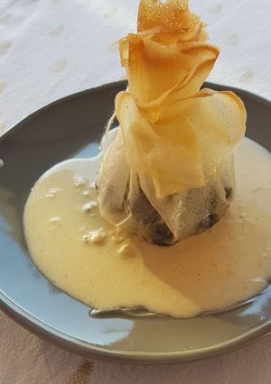 Une photo de °Aumonières d'escargots au vermouth °