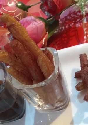 A picture of Churros with chocolate dip.