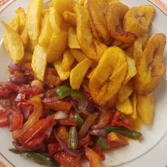 A picture of Fries with veggies sauce.