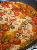 Pesce persico con pomodorini e olive