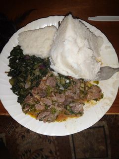 A picture of Beef,kales and ugali.