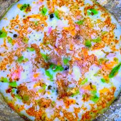 A picture of Rava veg dosa/utappam.