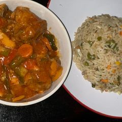 A picture of Gizzard sauced with rice.