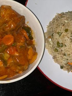 A picture of Gizzard sauced with rice.