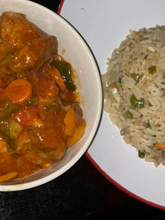 A picture of Gizzard sauced with rice.