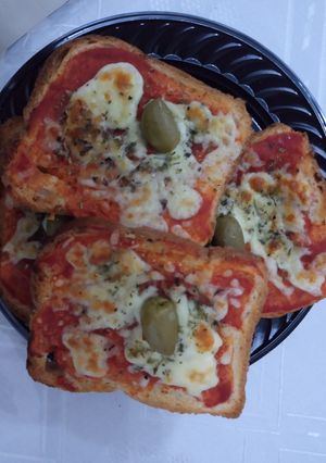 Una foto de Pizza de pan lactal