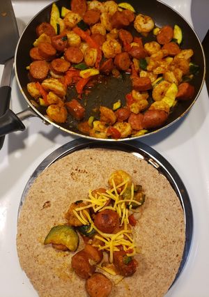 A picture of 1 skillet andouille sausage & shrimp.