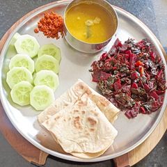 A picture of Red Amaranth and Beetroot Palya with Chapati: A karnataka special stir fry curry.