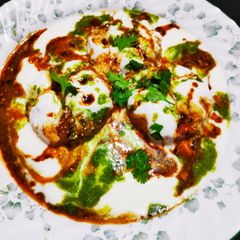 A picture of Lapsi tikki dahi chat.