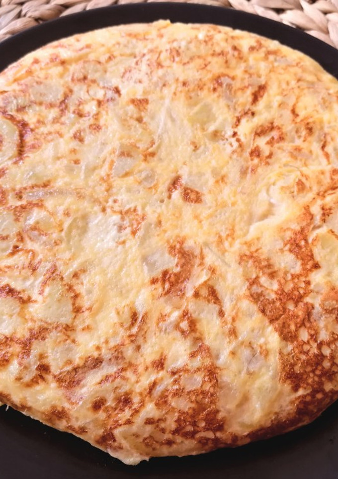 Una foto de Tortilla de patatas estilo Betanzos (con cebolla)