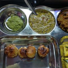 A picture of Daal baati chokha chutney dhokla.