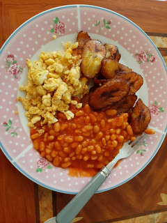 A picture of Fried plantain, egg and beans.