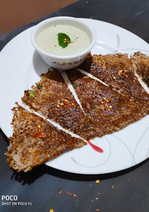 A picture of Ragi onion rava dosa with hotel style coconut chutney.