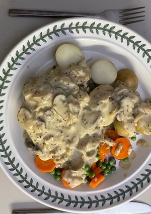 A picture of Pheasant breast in a sour cream sauce.