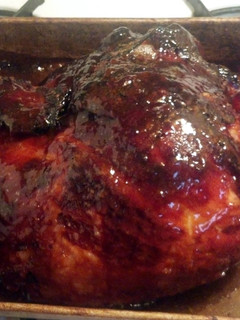 A picture of apple and brown sugar glazed ham.