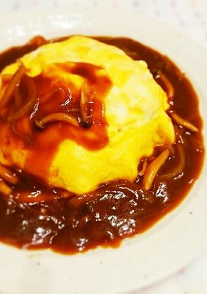 A picture of Fluffy Omurice with Demi-Glace Sauce.
