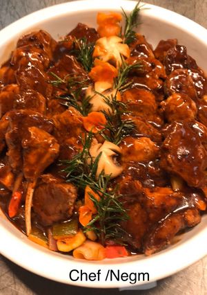 A picture of Lamb Chops 🐑 with Grilled Vegetables, Thyme, and Fresh Rosemary.