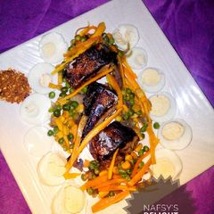 A picture of Pan grilled fish with veggie sauce.