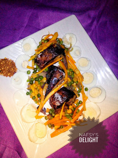 A picture of Pan grilled fish with veggie sauce.