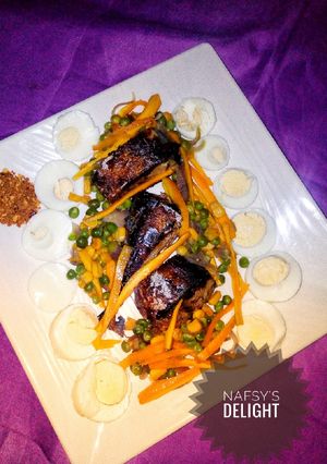 A picture of Pan grilled fish with veggie sauce.