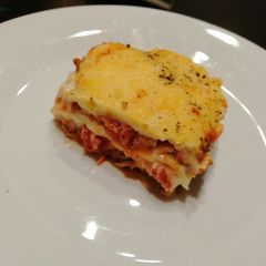 A picture of Cheesy, saucy lasagna.