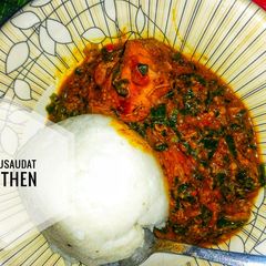 A picture of Groundnut soup with spring onions.