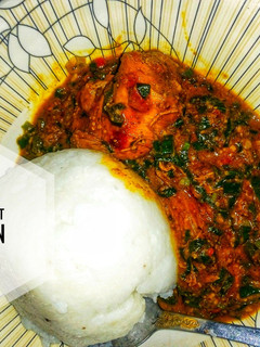 A picture of Groundnut soup with spring onions.