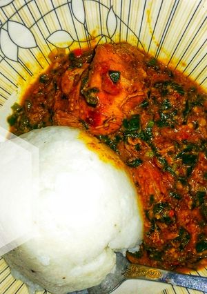 A picture of Groundnut soup with spring onions.