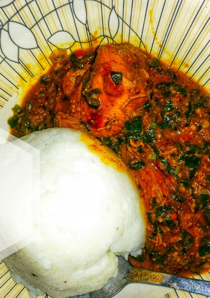 A picture of Groundnut soup with spring onions.