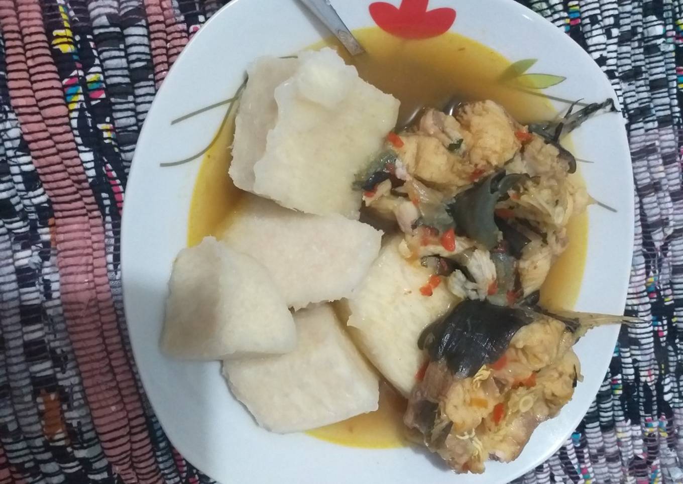 Boiled yam with cat fish pepper soup