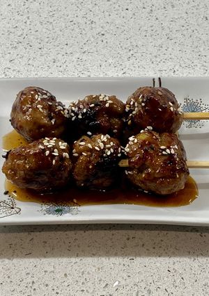 A picture of Tsukune (Japanese style turkey meatballs).