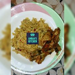 Jollof rice with pepperd chicken A picture of Jollof rice with pepperd chicken.
