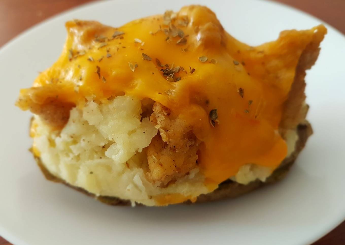 Fried potatoes with chicken and cheese